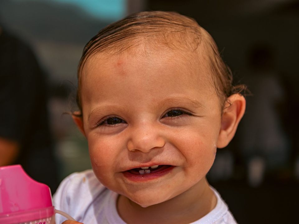 Smiling toddler showing healthy baby teeth, crowns for baby teeth at our pediatric dentist office in Christiansburg, VA
